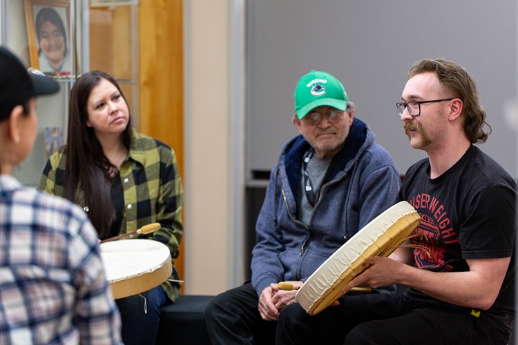 Students drumming together