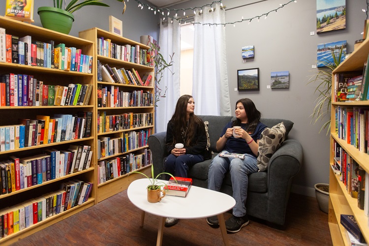 Students having tea together on a couch