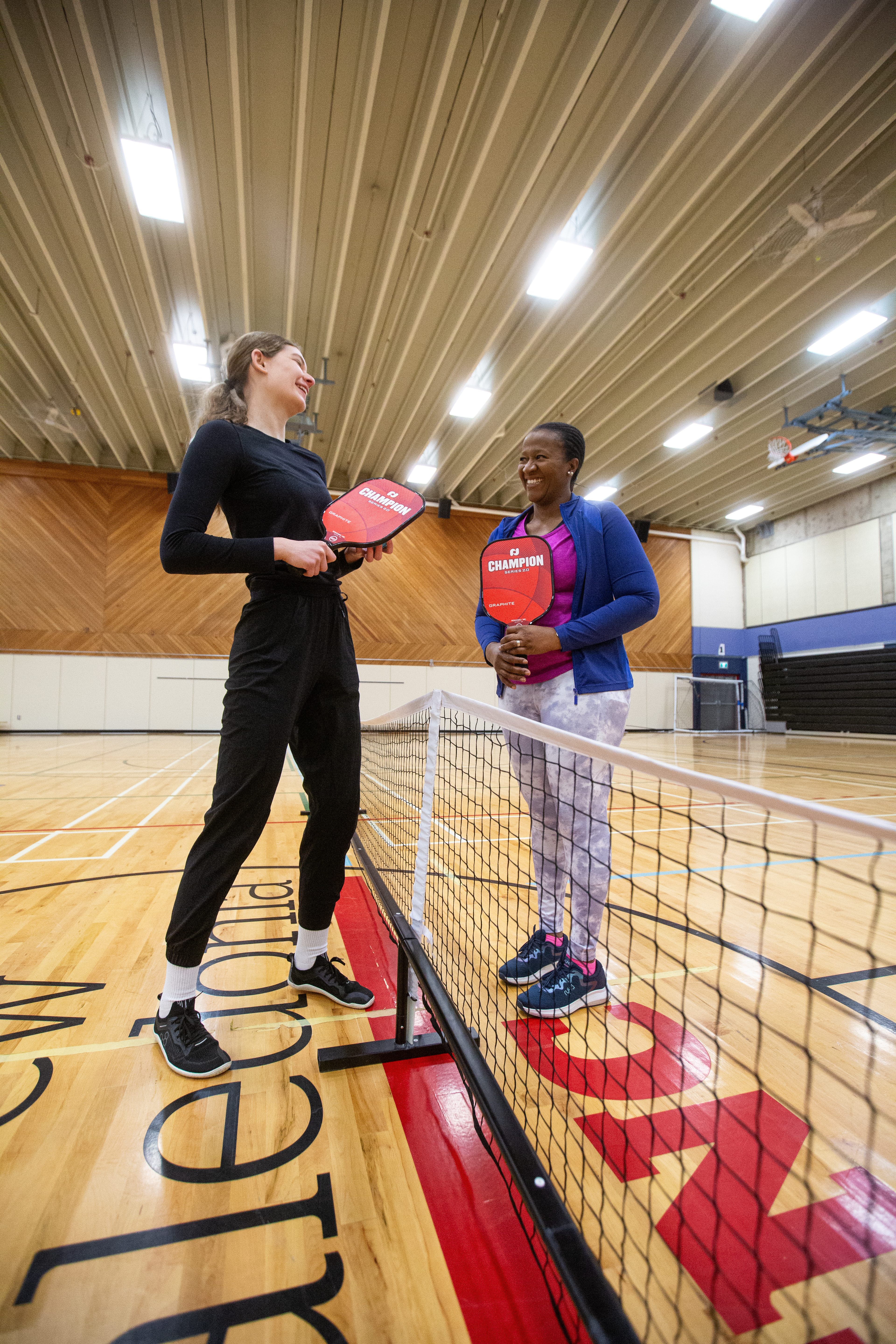 Two people playing pickleball