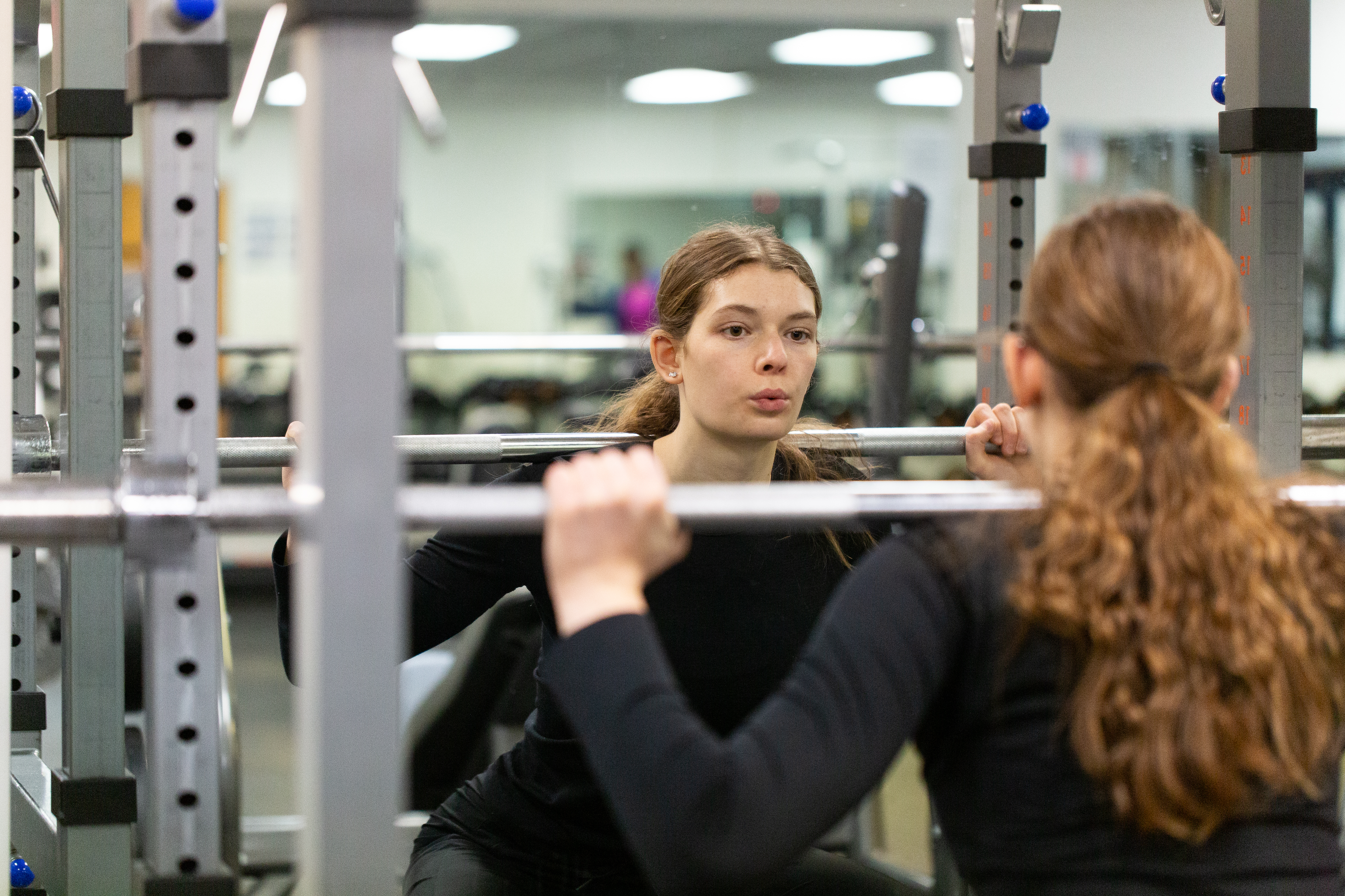 Student lifting weight